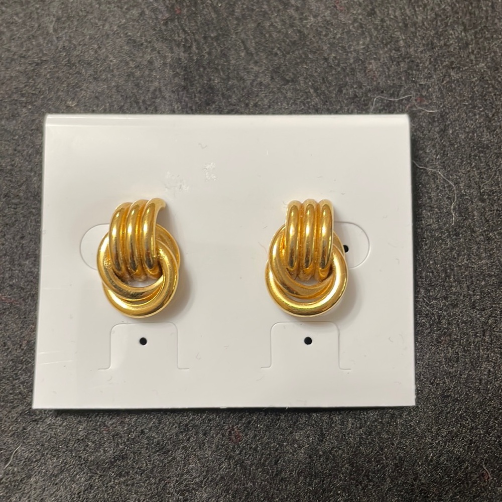 Gold toned earrings.